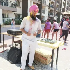 A photo from a Holi party, dressed in a traditional white kurta that's perfect for celebrating the festival of colors. Ready for the music and the mess!