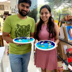 This couple proudly displays the serene koi pond art they created together. It is a beautiful and therapeutic project perfect for a relaxing weekend.