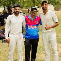 Two players with a senior club member, showcasing the blend of experience and youth that drives our team forward.