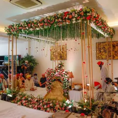 A serene and beautiful setup for a Sukhmani Sahib Path at home. I used a floral canopy with hanging strings of flowers over the main seating area to create a divine atmosphere, perfect for spiritual gatherings and blessings.