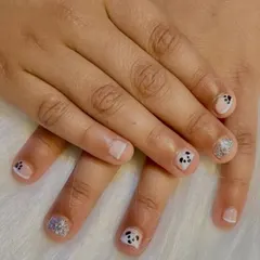 A perfect example of how I can create magic even on bitten nails. This super cute set features tiny, hand-painted pandas and silver glitter accent nails.