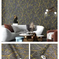 A modern living room with a dark grey wallpaper featuring a gold branch pattern, creating a dramatic and elegant accent wall.