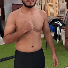 Vraj, another one of our fighters, looking focused and strong at the weigh-ins. He is ready to step into the cage and showcase his skills.