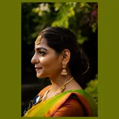 A profile shot of Nithyashri showing her natural-looking makeup and simple, elegant hairstyle. My goal is always to make you feel like the best version of yourself.
