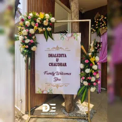 An elegant welcome sign for the Dhalediya and Chaudhar families. I framed the sign with a modern gold stand and asymmetrical floral arrangements, creating a stylish and welcoming entrance piece.