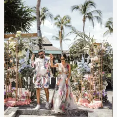 A stylish entrance at a beachside welcome party in Thailand. This shot captures the fun, high-fashion vibe of a destination wedding.