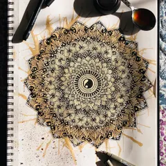 Experimenting with coffee-staining to give this yin-yang mandala an aged, unique look. My sketchbook is a place for play and trying new techniques.