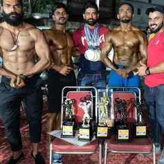 The team after a successful competition. Each athlete brought their best physique to the stage, showcasing incredible muscle definition and symmetry.