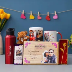 This all-in-one Valentine's combo is packed with love. It features a personalized wooden frame, a Bluetooth speaker with your photos, a custom mug, a name-engraved bottle, and other sweet treats.