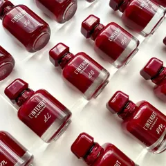 A collection of the finished Givenchy bottles, each with unique initials. This showcases the consistency and elegance I deliver for brand events.