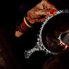 A creative and artistic shot of the bride getting ready. I look for unique angles and lighting to capture the quiet, beautiful moments of anticipation before the main ceremony.