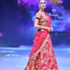 A classic red bridal lehenga, rich with intricate gold floral embroidery. I designed this for the bride who wants a timeless, regal look that honors our beautiful traditions.