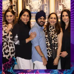 Guests looking stylish and ready to party at The Quorum Club. The custom-branded frame adds a professional and personalized touch to every photo.