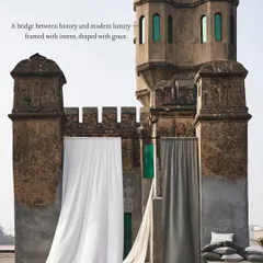 I believe fabric is poetry in motion. Here, we juxtaposed modern luxury drapes against the raw texture of a historic Indian fort, creating a bridge between past and present. This image demonstrates my approach to telling a story through texture, light, and environment.
