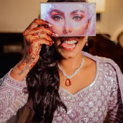 A fun and quirky photo of the bride during her getting-ready session. These playful, behind-the-scenes shots add so much personality to your final gallery.