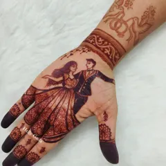 The beautiful dark stain of the engagement mehndi, showing the dancing couple portrait. My natural henna gives this rich color.