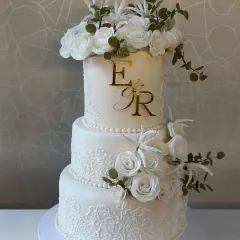 I have a deep respect for tradition, and this classic three-tier Christian wedding cake is a testament to that. It's a rich, moist fruit cake covered in marzipan and fondant, decorated with intricate lace work and handmade sugar flowers. This cake is made to stand the test of time, just like a marriage.