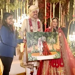 Presenting the completed canvas to the happy couple is always a highlight. Here you can see the scale of the 30x36 inch gallery canvas and the joy of having a unique piece of art from your wedding day.