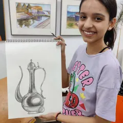 The finished pencil sketch of a metal jug. This piece demonstrates a strong understanding of form, reflection, and texture, all essential components of a strong art portfolio.