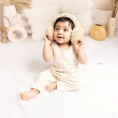Baby milestone shoots hold such precious memories. This one-year-old shot, with the cute earmuffs, was so worth the effort to get that perfect, adorable expression.