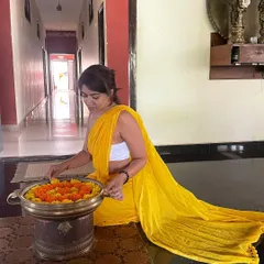 For my graduation day from advanced teacher training, I chose to wear yellow, the color of knowledge, the Guru, and light. Here I am arranging flowers, a small act of devotion and gratitude.