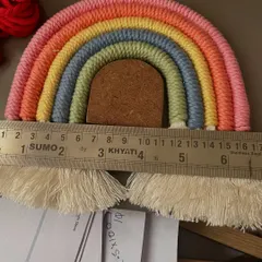 Here you can see one of the rainbow stencils in action. Using the template ensures clean curves and a professional finish, which is so important for creating high-quality macramé art.