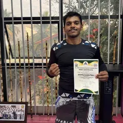 Holding my merit certificate after winning Gold at the 2024 Karnataka Open. It’s always a great feeling to represent my team and bring home a win.