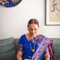 A quiet, candid moment of her reading a book. These lifestyle shots are just as important as posed portraits, as they capture the simple, everyday activities that tell the story of a person's life.