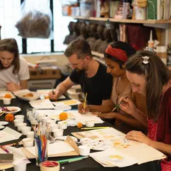 A group of participants deeply focused on their paintings during our botanical ink workshop. The studio is filled with concentration and creativity as everyone explores the unique qualities of the inks they just helped create.