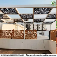 Our designs combine strength with intricate beauty. This luxury pergola at Natura Atavi features a durable puff sheet roof for all-weather protection, complemented by custom CNC designer panels that provide privacy and a bold, artistic statement.