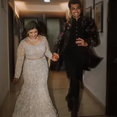 The happy exit. This candid shot of Kiran and Veer walking hand-in-hand down the hallway, full of smiles, perfectly captures the excitement at the end of their engagement celebration.