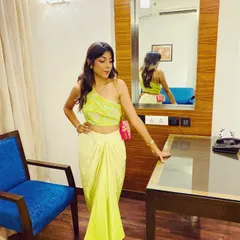 This modern, indo-western outfit is perfect for a cocktail or Sufi night. The one-shoulder top and draped skirt in this bright lime green are both trendy and comfortable. I love finding unique pieces like this for my clients.
