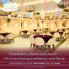 The ambiance of our hall is defined by its elegant details. Modern chandeliers cast a warm glow over the space, complemented by tasteful decor like hanging floral arrangements and colorful umbrellas, creating a charming and cheerful atmosphere for any party.