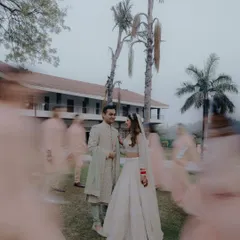 A creative shot using motion blur to capture the whirlwind of the wedding day, with the couple as the calm, happy center of it all. It's a beautiful, artistic representation of their moment.