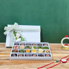 Our 'Rakhi ki Mitaas' 24-piece box is the ultimate luxury. Each piece is a guilt-free, exotic dry fruit mithai, crafted from the finest pistachios, almonds, and hazelnuts.