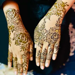A beautiful and dense Arabic floral design. The pattern features prominent roses with detailed shading and delicate leaves, creating a look that is both bold and feminine.