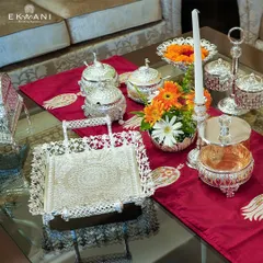 I designed this festive tablescape for a Diwali celebration, featuring an assortment of my silver-plated serveware. The intricate trays, bowls, and candle holders add a touch of opulence and traditional charm to the occasion.