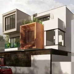 This view highlights the minimalist structure and open spaces of the Nidhi Nilayam project. The projecting volumes and the distinctive corten steel finished box create a dynamic composition, showing how simple forms can be combined for an elegant and chic home design.