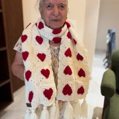 Wrap yourself in love with our signature heart muffler. Dadi is showcasing the classic white and red version here, complete with playful tassels. It’s a simple, heartfelt design that adds a touch of handmade charm to any outfit.