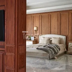 This is a two-bedroom suite I designed in DLF Camellias. The rich wood paneling and marble flooring create a timelessly comforting feel, where every detail rests effortlessly in place. It is a real space, as it comes alive.