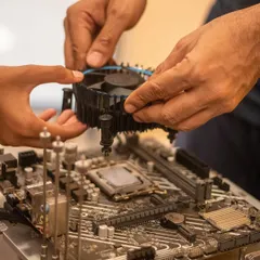 This is what real engagement looks like. We guide students as they handle complex components like motherboards and cooling fans, demystifying the technology inside a gaming PC and building their confidence with every part they install.