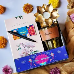 To break the monotony of typical Diwali gifts, I designed this modern hamper for the younger generation. It includes a personalized tumbler, a sleek black pen, and a floral-print notebook, combining festive happiness with everyday utility.
