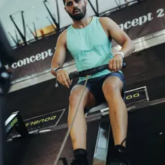 The rowing machine is a formidable challenge, testing both cardiovascular endurance and total-body strength. This moment, deep into the competition, is where mental fortitude takes over. My goal is to help clients build this same resilience through smart, sustainable training.
