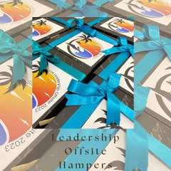 Custom-branded gift boxes for a corporate leadership offsite event in 2023. The vibrant branding and neat packaging reflect a professional and thoughtful gesture.