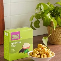 Healthy quinoa rings from Hubba Hubba Foods, styled with a potted plant to reinforce the product's natural and wholesome qualities.