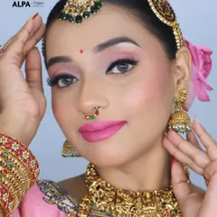 A close-up on the makeup, showing the soft pink eyeshadow, winged liner, and the unique nose pin that completes the look.
