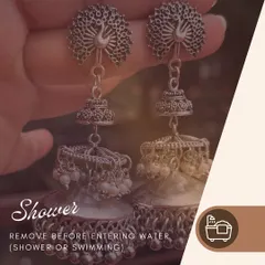 A quick tip for your jewellery. Always remove your earrings before showering or swimming to protect them from damage. This pair of silver peacock jhumkas deserves all the care.