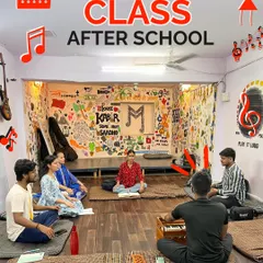 Our "Vocal Class After School" provides a dedicated space for students to practice and find their voice. The room is designed to be inspiring, with musical art covering the walls.