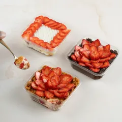 Dig into our made-to-order desserts loaded with fresh strawberries. Pictured here are our Strawberry Biscoff Cheesecake, Strawberry Tres Leches, and Traditional Chocolate Strawberry Gateau tubs.