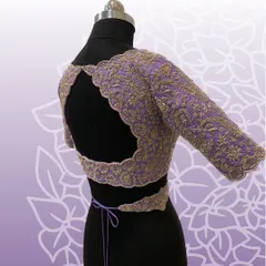 This lavender bridal blouse features a stunning open-back design with scalloped, embroidered edges and a matching embroidered waistband.